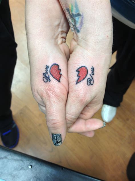 heart 2 hand tattoos